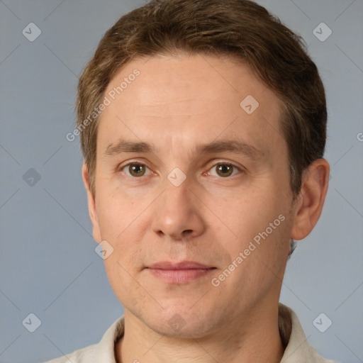 Joyful white adult male with short  brown hair and grey eyes