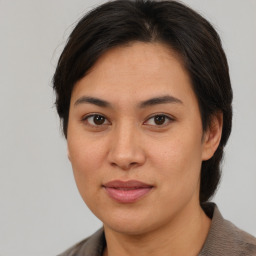 Joyful asian young-adult female with medium  brown hair and brown eyes