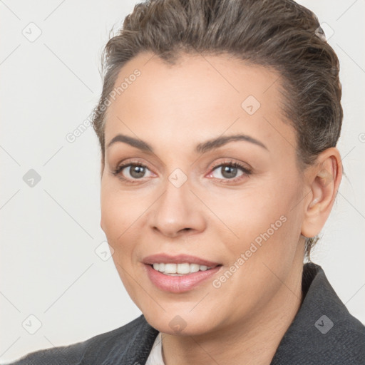 Joyful white young-adult female with short  brown hair and brown eyes