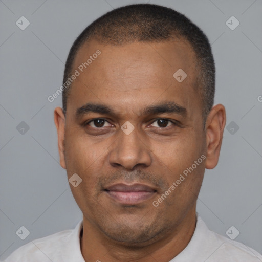Joyful latino adult male with short  black hair and brown eyes