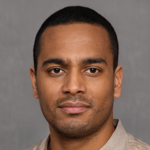 Neutral latino young-adult male with short  brown hair and brown eyes