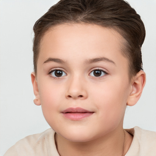 Joyful white child female with short  brown hair and brown eyes