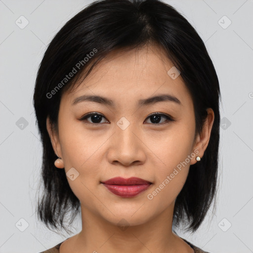 Joyful asian young-adult female with medium  black hair and brown eyes