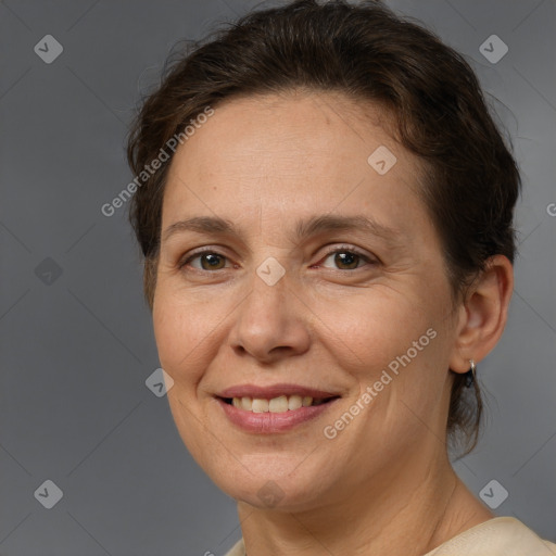 Joyful white adult female with medium  brown hair and brown eyes