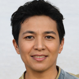 Joyful asian young-adult male with short  black hair and brown eyes
