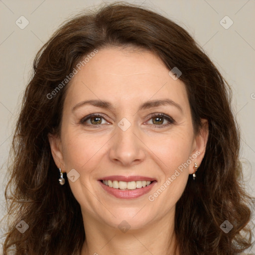 Joyful white adult female with long  brown hair and brown eyes