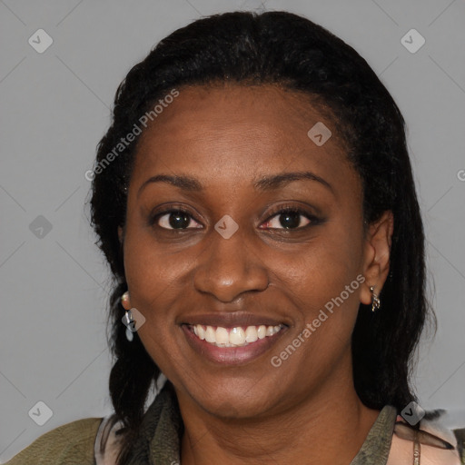 Joyful black adult female with medium  black hair and brown eyes