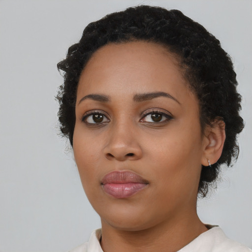 Neutral latino young-adult female with short  black hair and brown eyes