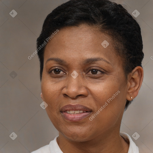 Joyful black adult female with short  brown hair and brown eyes