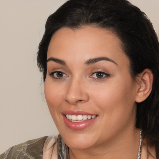 Joyful white young-adult female with long  brown hair and brown eyes