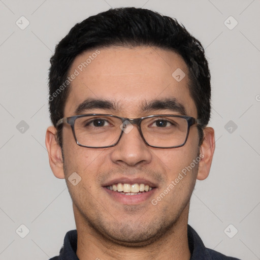 Joyful white young-adult male with short  black hair and brown eyes