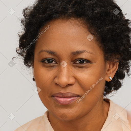 Joyful black adult female with medium  brown hair and brown eyes