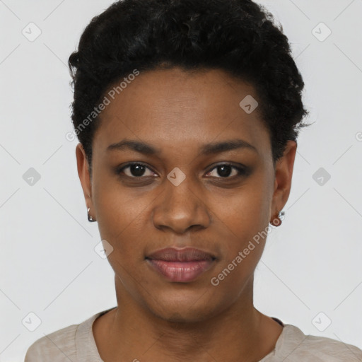 Joyful black young-adult female with short  black hair and brown eyes