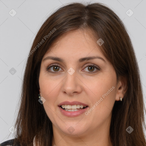 Joyful white adult female with long  brown hair and brown eyes