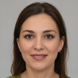 Joyful white young-adult female with medium  brown hair and brown eyes