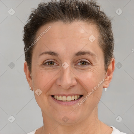 Joyful white adult female with short  brown hair and brown eyes