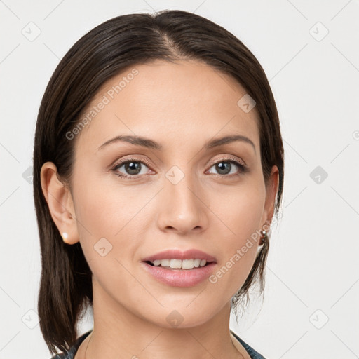 Joyful white young-adult female with medium  brown hair and grey eyes