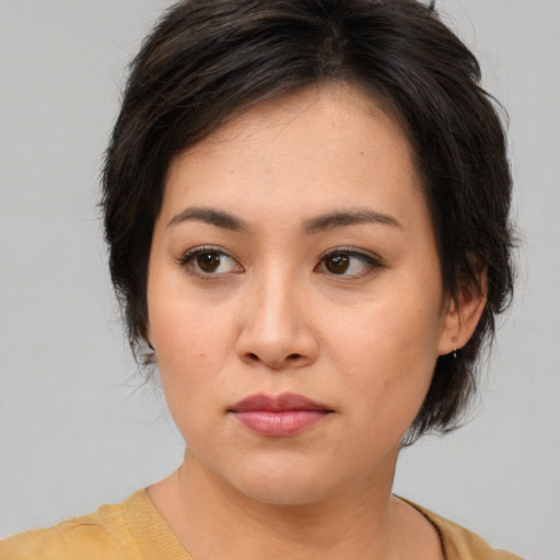 Neutral asian young-adult female with medium  brown hair and brown eyes