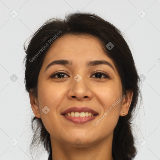 Joyful latino young-adult female with long  brown hair and brown eyes