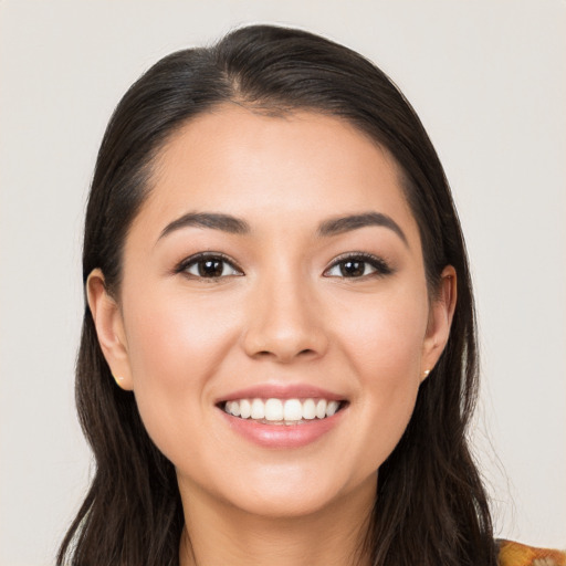 Joyful white young-adult female with long  brown hair and brown eyes