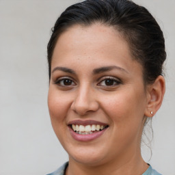 Joyful white young-adult female with medium  brown hair and brown eyes