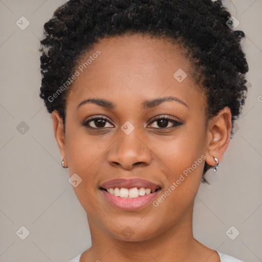 Joyful black young-adult female with short  brown hair and brown eyes