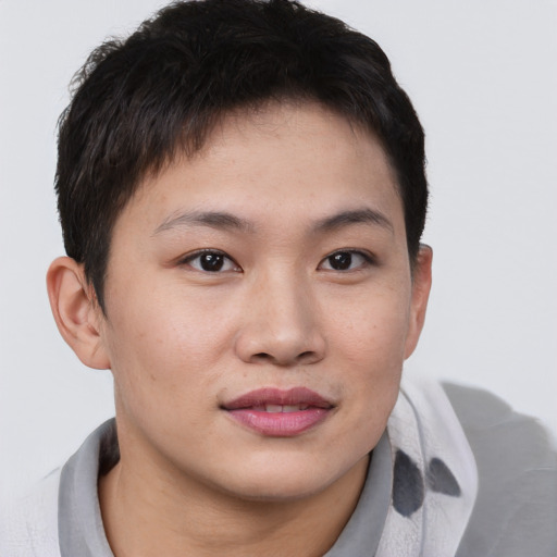 Joyful asian young-adult female with short  brown hair and brown eyes