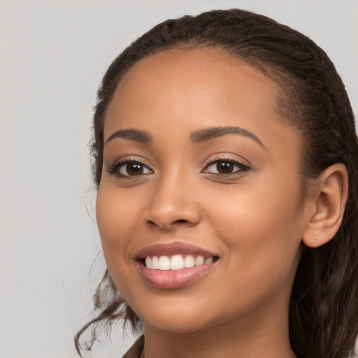 Joyful white young-adult female with long  brown hair and brown eyes