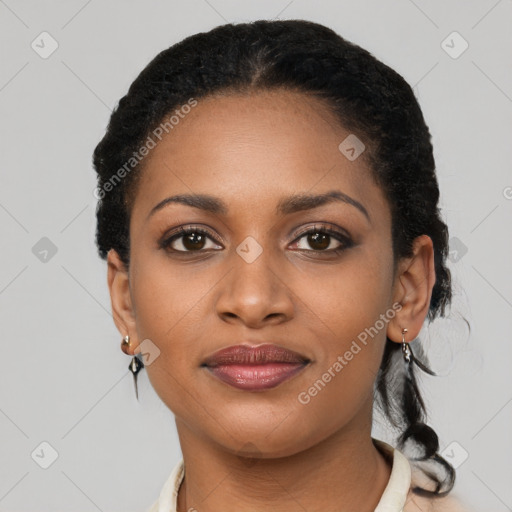 Joyful black young-adult female with short  black hair and brown eyes