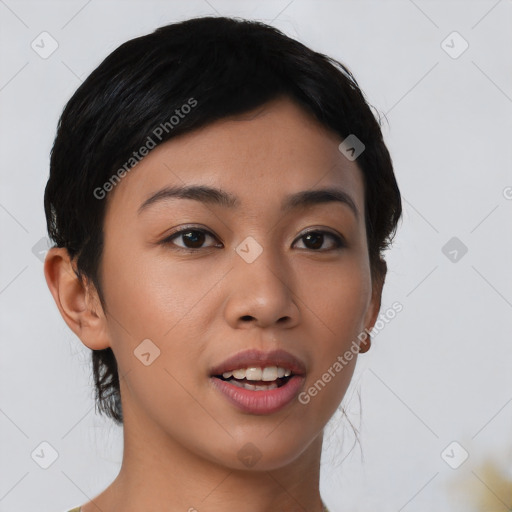 Joyful asian young-adult female with short  black hair and brown eyes