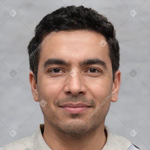 Joyful white young-adult male with short  black hair and brown eyes