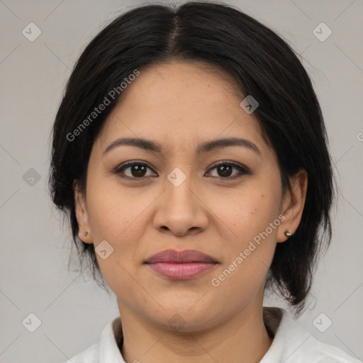 Joyful latino young-adult female with medium  brown hair and brown eyes