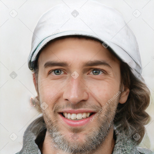 Joyful white adult male with short  brown hair and grey eyes