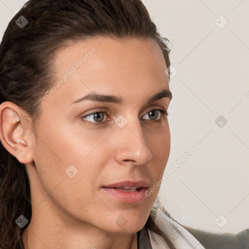 Neutral white young-adult female with long  brown hair and brown eyes