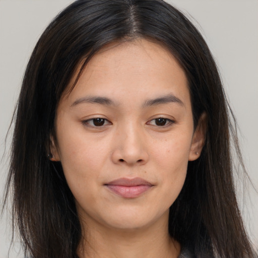 Joyful asian young-adult female with long  brown hair and brown eyes