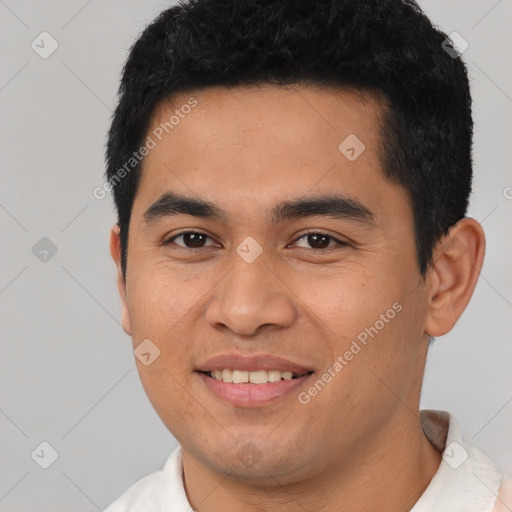 Joyful latino young-adult male with short  black hair and brown eyes