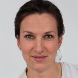 Joyful white adult female with short  brown hair and grey eyes