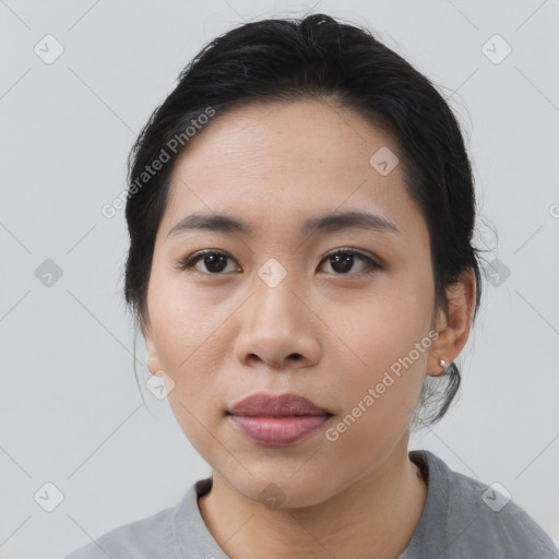 Joyful asian young-adult female with medium  black hair and brown eyes