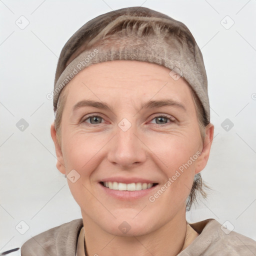 Joyful white adult female with short  brown hair and grey eyes