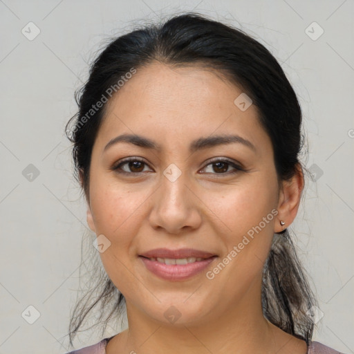 Joyful latino young-adult female with medium  brown hair and brown eyes