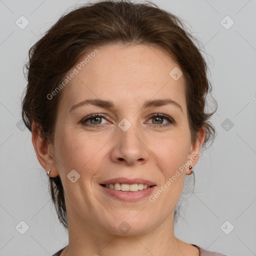 Joyful white adult female with medium  brown hair and grey eyes