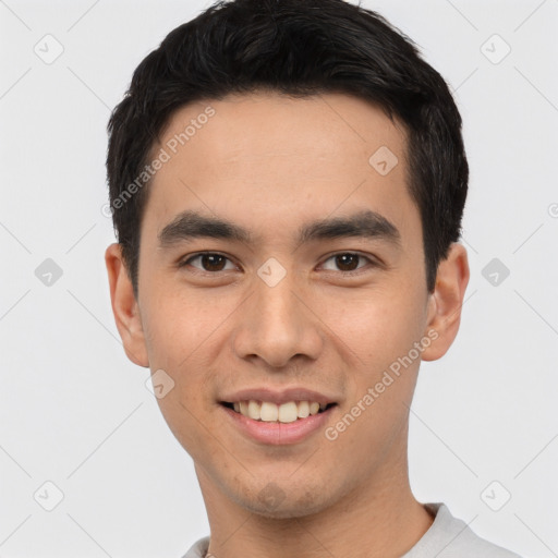 Joyful white young-adult male with short  black hair and brown eyes