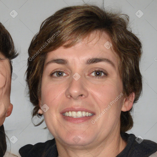 Joyful white adult female with medium  brown hair and blue eyes