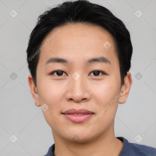 Joyful asian young-adult male with short  black hair and brown eyes