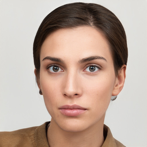 Neutral white young-adult female with short  brown hair and brown eyes