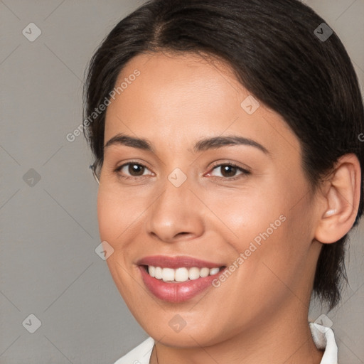 Joyful white young-adult female with medium  brown hair and brown eyes