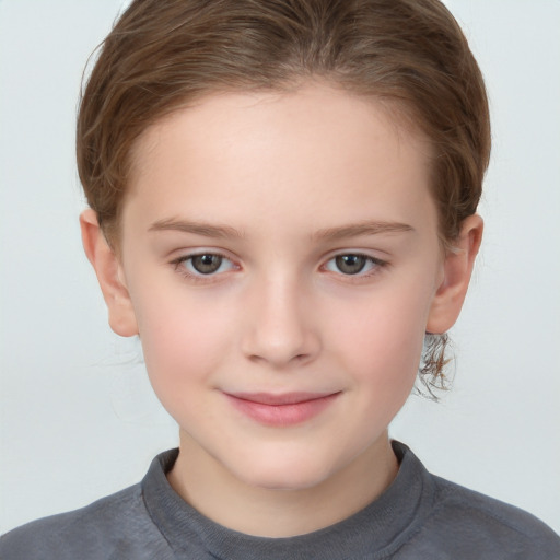 Joyful white child female with short  brown hair and brown eyes