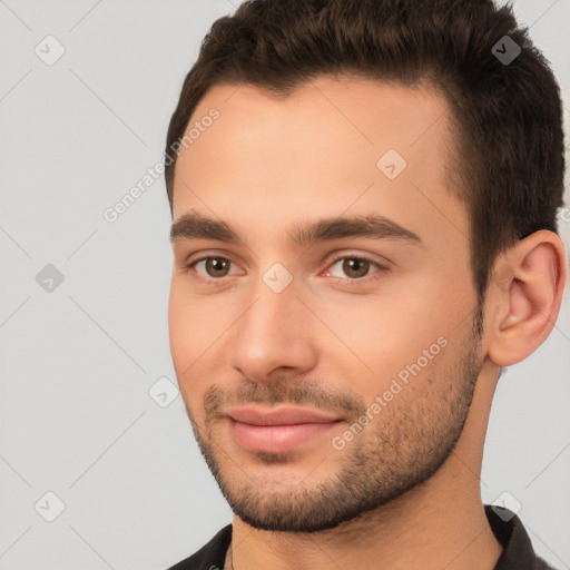 Joyful white young-adult male with short  brown hair and brown eyes