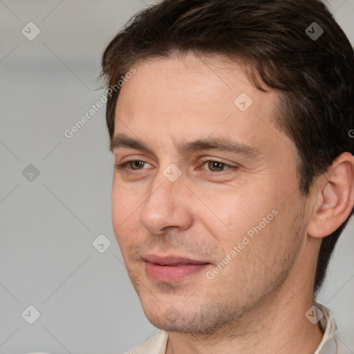 Joyful white adult male with short  brown hair and brown eyes