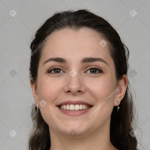 Joyful white young-adult female with long  brown hair and grey eyes